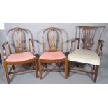 A set of six George III mahogany arch top dining chairs,