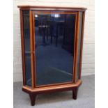 A late 19th century satinwood banded mahogany floor standing glazed corner cupboard on bracket feet,