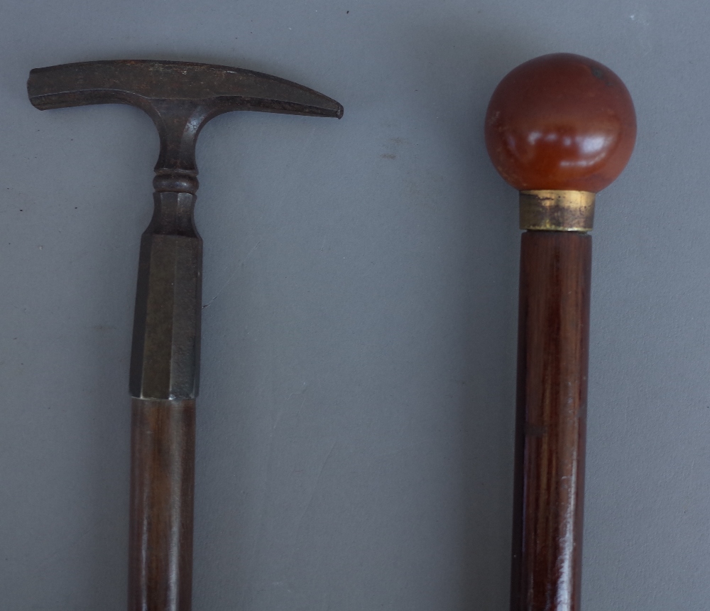 An early 20th century gadget cane with illuminating spherical pommel (91.