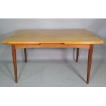 A 20th century teak drop end extending table on tapering supports,