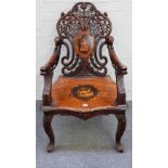 A 19th century marquetry inlaid Black Forest/Swiss musical open armchair on scroll supports,