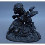 A Continental bronze figure, late 19th century, depicting Cupid and a dove over a nest of chicks,