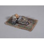 An Austrian cold painted figure of a reclining lady.
