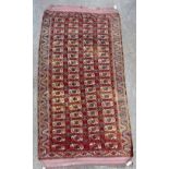 A Kizyl Ayak Turkeman carpet, the madder field with four columns of nineteen guls,