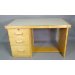 A 20th century oak kneehole desk with three drawers, 120cm wide x 72cm high.
