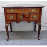 A mid-18th century walnut and mahogany lowboy with five frieze drawers on club supports,