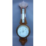A Victorian mahogany eight inch wheel barometer, with foliate inlay,
