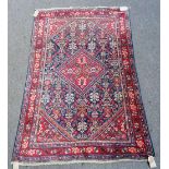 A Mahal rug, Persian, the indigo flower filled field with a similar madder diamond,