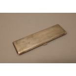 A silver rectangular cigar case, to hold slim cigars, gilt within,
