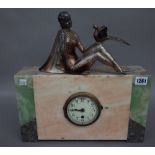 An Art Deco figural mounted marble mounted clock with central enamel dial (36cm high),