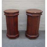 A pair of 20th century hardwood octagonal bedside tables on plinth bases, 45cm wide x 77cm high.