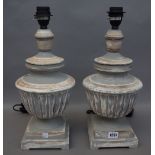 A pair of modern grey/distressed wooden table lamps, of classical,