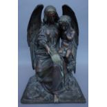 An early 20th century bronze figure group depicting The Archangel Gabriel with a putto on a