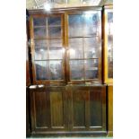 A pair of early 20th century mahogany two door bookcase cabinets, 125cm wide x 208cm high, (2).