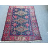 An antique Soumac carpet, the dark blue field with triple pole medallion,