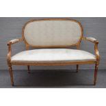 A Louis XVI style salon suite comprising; open arm sofa, 135cm wide x 100cm high,