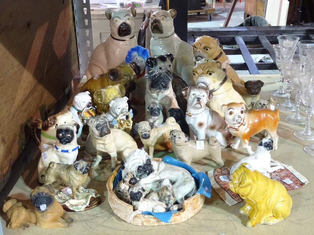 A quantity of Victorian and later ceramic models of pugs, (qty).