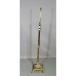 A 20th century brass standing lamp on square column plinth base, 147cm high.