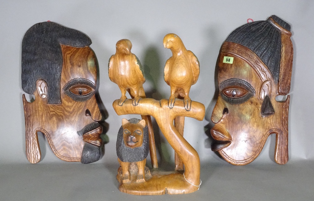 A pair of 20th century hardwood African hanging facial panels,