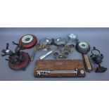 A quantity of collectables including a Regency style bronze pocket watch holder of urn form (17.