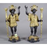 A pair of gilt metal and patinated Nubian figures.