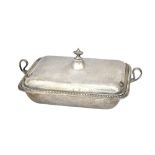 A silver twin handled lidded entree dish, the base decorated with a beaded rim,