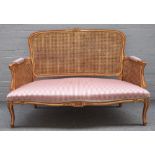 A Louis XV style salon suite comprising sofa, 135cm wide x 93cm high, pair of tub back chairs,