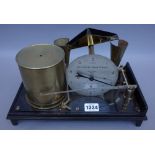 A Short & Mason rain recording gauge, early 20th century, brass and ebonised cast iron (30.