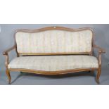 A 19th century French walnut hump back sofa with open arms on cabriole supports, 171cm wide.