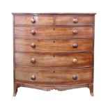 An early Victorian mahogany tall bowfront chest of two short and four long drawers,