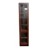 A mahogany bookcase, of narrow proportio