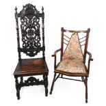 A Victorian oak hall chair, in Charles II style, the high arched back heavily foliate,