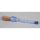 A Chinese blue overlay glass brush handle, six character Qianlong mark in a line,