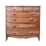 An early Victorian mahogany tall bowfront chest of two short and four long drawers,