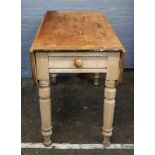 A Victorian waxed pine Pembroke table, with two end drawers, 101cm wide x 55cm deep x 76cm high.