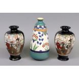 An Ispahan pattern vase, 19cm high and a pair of Japanese Satsuma vases, 15cm high (3).