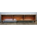 An Edwardian mahogany two tier wall hanging bookcase, with turned columnar supports,