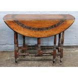 A late 17th century style carved walnut gateleg table, 85cm wide, 66cm deep, 63cm high.