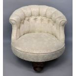 An Edwardian walnut frame button down upholstered nursing chair.
