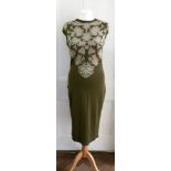 Alexander McQueen; A rayon and silk green dress, decorated with flowers, size large.