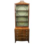 A George III mahogany boxwood strung bookcase, enclosed by a glazed astragal door,