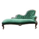 A Victorian foliate carved walnut frame chaise longue, circa 1860, having a scrolled,