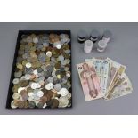 A large collection of world coinage and a collection of bank notes including India,