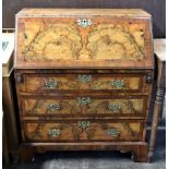 A reproduction mid 18th century style figured walnut and crossbanded bureau,