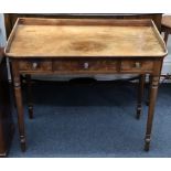 A Regency mahogany dressing table, with three quarter gallery, three frieze drawers,