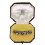 A diamond bar brooch, the central old cut diamond in Georgian cut down setting,