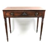 A Regency mahogany side table, the rectangular top above a frieze drawer, on ring turned legs,