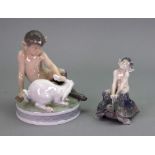 A Royal Copenhagen figure faun with rabbit 439, 14cm high and faun on turtle 858, 10cm high (2).