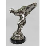 An extremely large silvered metal model of the 'Spirit of Ectasy', on a black marble base,