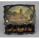 A Victorian papier mache desk top stationery box, rectangular and of serpentine outline,